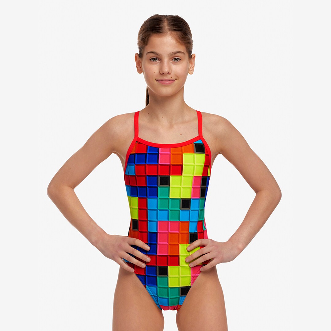 Boy in girl's one piece swimsuit store